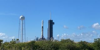 A SpaceX Falcon 9 rocket carrying 57 Starlink internet satellites and two BlackSky Global Earth-imaging satellites stands atop its Pad 39A launch site at NASA's Kennedy Space Center, Florida on July 8, 2020.