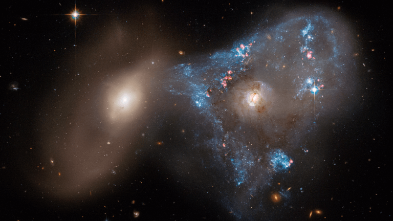 In an astounding space scene, two galaxies pummeled through each other_621fe7bc76964.png