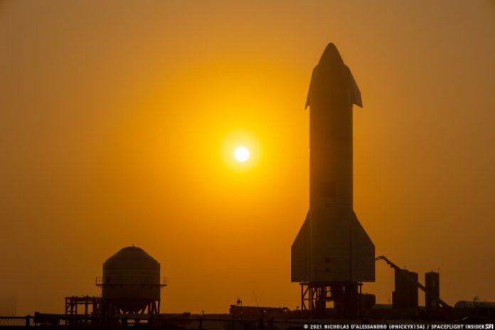 Starship SN10 and test tank SN7.2 stand tall under a hazy Boca Chica sunset. Credit: Nicholas D'Alessandro / Spaceflight Insider