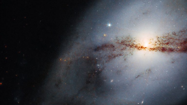 Hubble Space Telescope images twisted galaxy shaped by a big neighbor_629f4e8d9da7b.jpeg