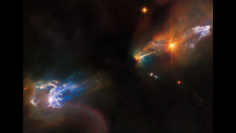 Newborn twin stars blast out jets of rainbow-colored gas in new Hubble image_636901e5e6017.jpeg