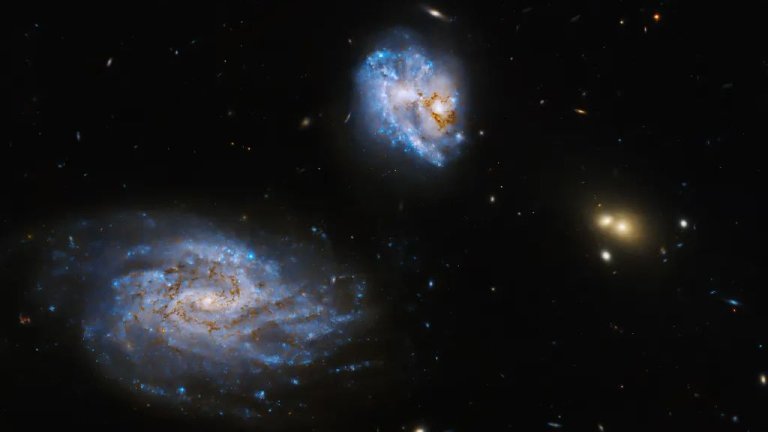 Hubble Space Telescope sees colliding galaxies aglow with stars_65b033db58fda.jpeg