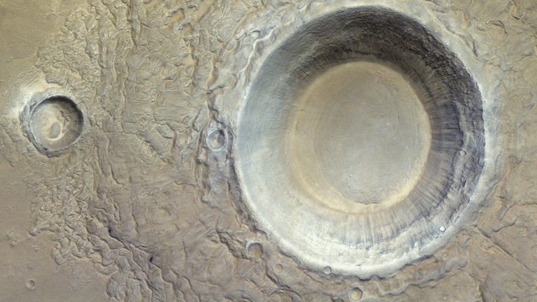 A massive, icy Mars crater stares up at a Red Planet orbiter (image)_664680da0b288.png