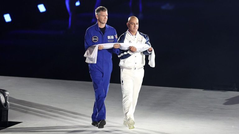 Astronaut John McFall carries Paralympic flag at opening ceremony Aug. 28_66cfabdd229da.jpeg