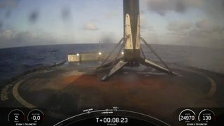 closeup of a rocket sitting on the deck of a ship at sea