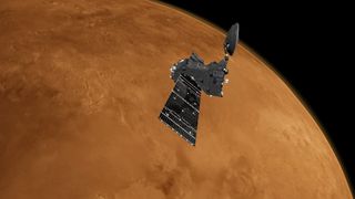 a cone-shaped spacecraft with two rectangular solar arrays above a reddish-orange planet