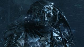 Screenshot from the movie Alien vs. Predator. Close up of a Predator whilst out in a storm. They are wearing full armor and have long dreadlocks.