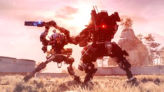 Two mech suits battling in a desert environment, one with a sword raised in the air.