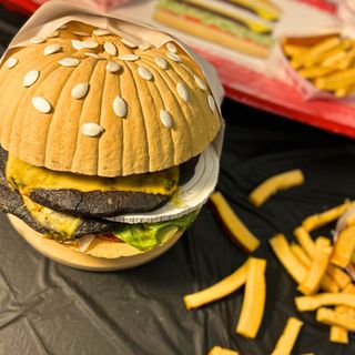 a pumpkin carved to resemble a cheeseburger