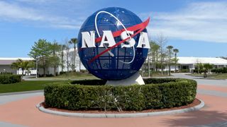 outdoor sculpture of nasa's spherical blue-and-white 