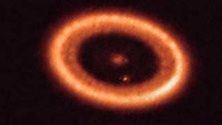 The protoplanetary disk around the infant star PDS 70 which may contain a third planet