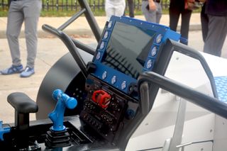 closeup of the controls and dash display of a new moon rover