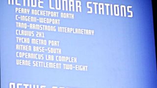 A blue backlit sign displays a list in white text of fictional lunar stations